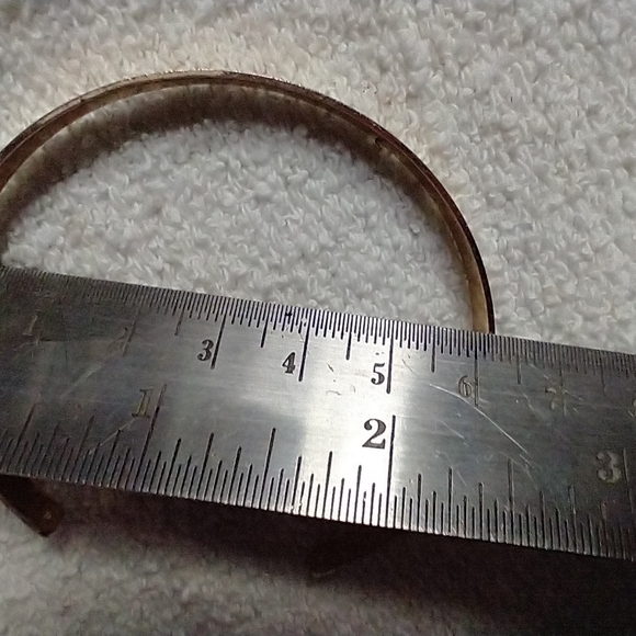 Goldtone cuff bracelet says wanderlust:  irresistible impulse to travel - Picture 3 of 3